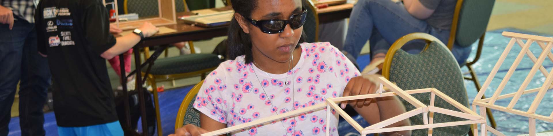 A blind student works on her engineering project during an NFB EQ program